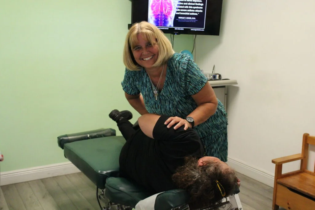 Dr. Jacqueline Legault Valcourt caring for a patient in the Hollywood clinic